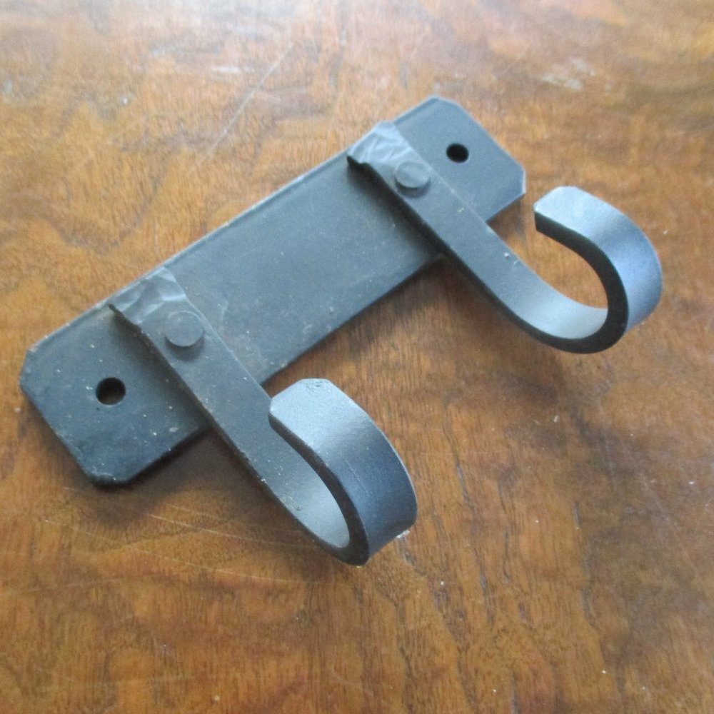 Rustic Wrought Iron Coat Hook with 2 hooks hangs on wall